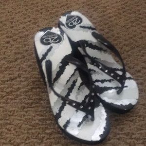 Black and white Bebe wedge flip flops